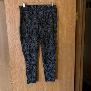 Torrid size 2 leggings. They are black and grey with small skulls.